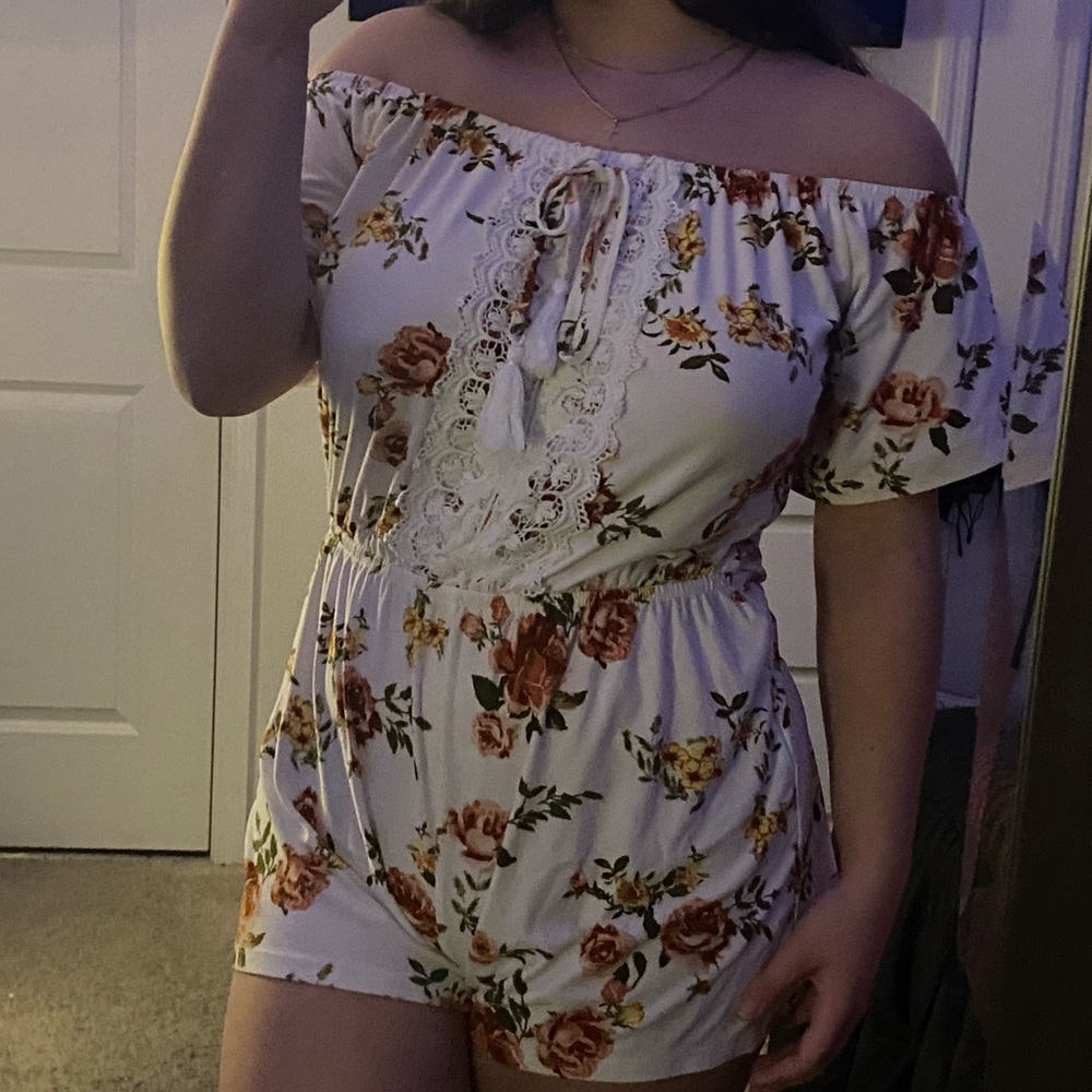 White Floral Flowing Romper .